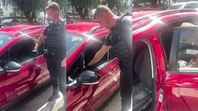 Policista zachránil psa z rozpáleného auta